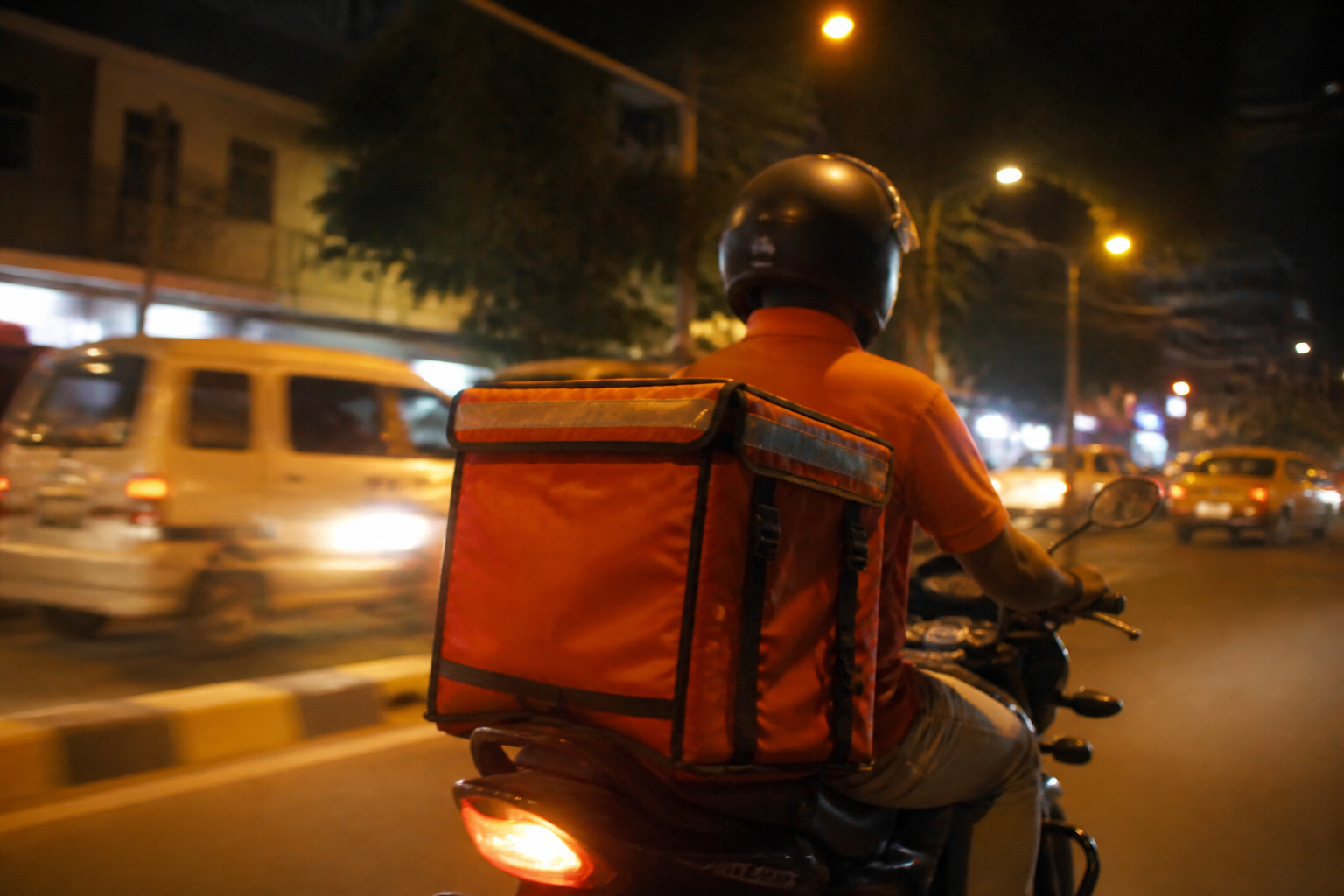 Night-time food delivery on a city street
